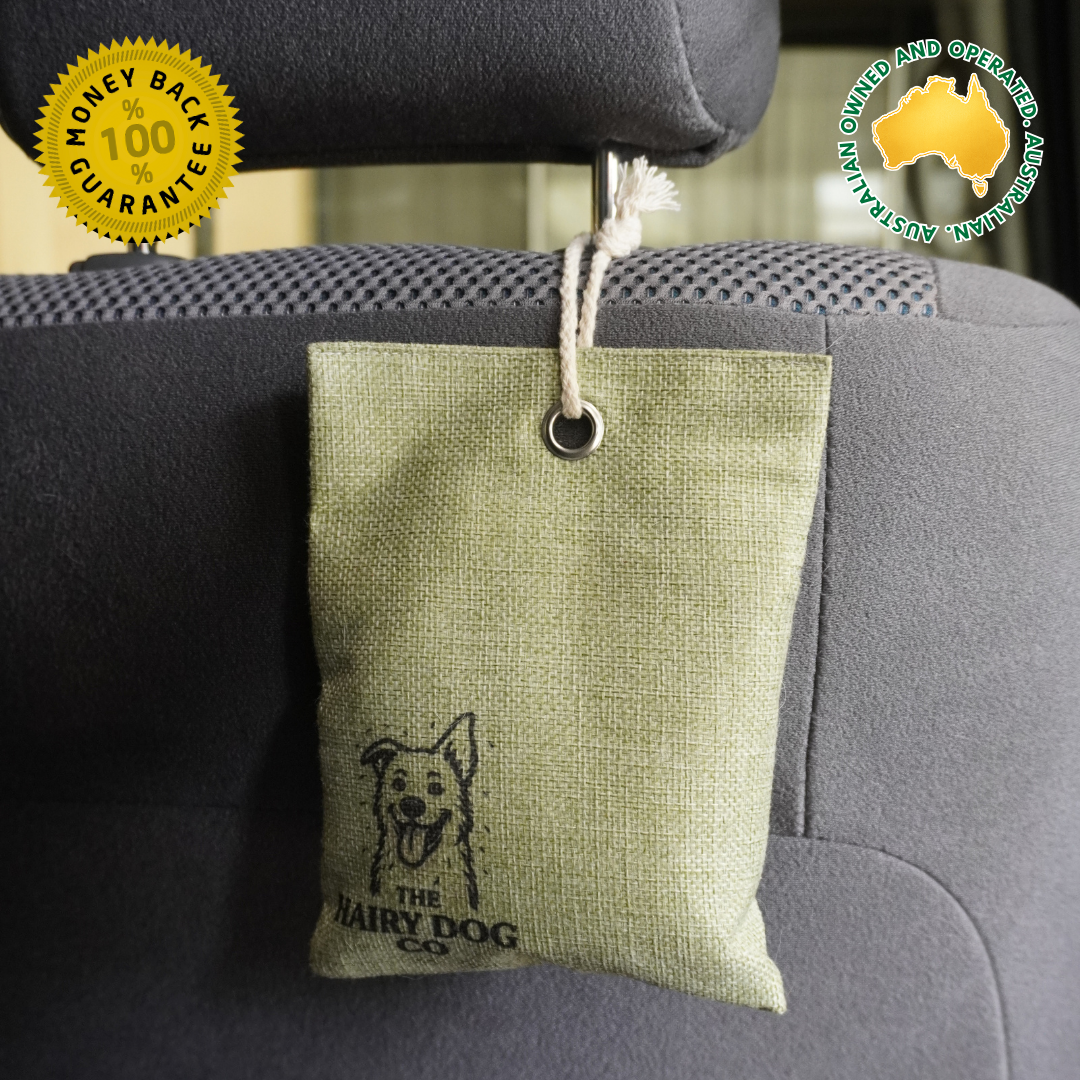 Green Activated charcoal moisture absorber hanging from car headrest to remove wet dog smells and moisture, Australian owned and operated.